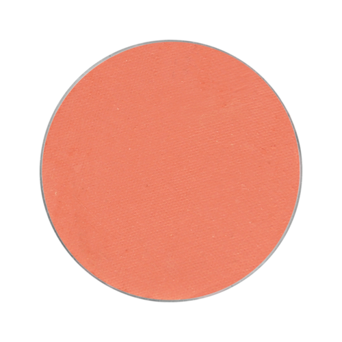En rund, persikfärgad makeup blush med matt yta.
