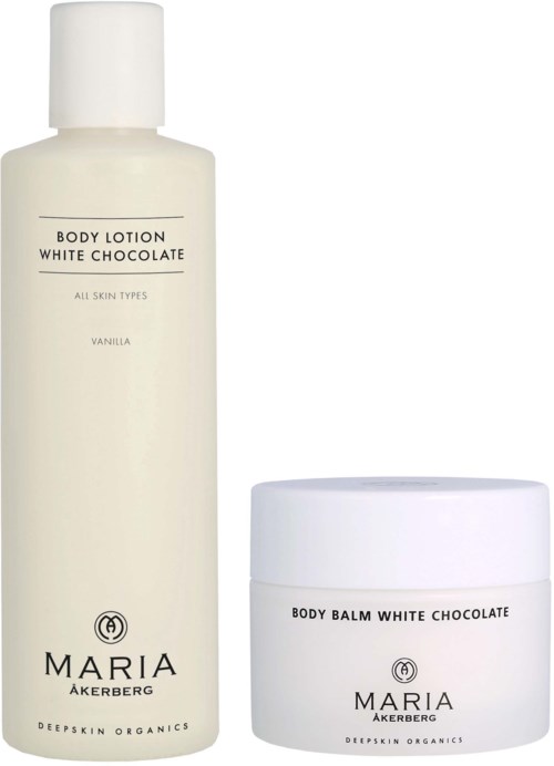 En vit lotionflaska och en vit balmkruka, båda märkta 'Maria Åkerberg White Chocolate' för hudvård.