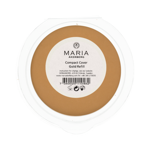 A round container lid with a white center and gold refill label, showing product and brand information.