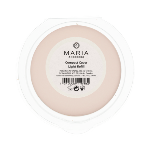 A round, pink compact with a white label in the center showing brand and product details.