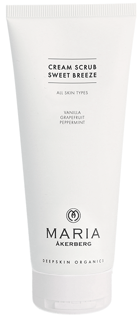 En hvit tube merket 'Cream Scrub Sweet Breeze' med duft av vanilje, grapefrukt og peppermynte. Passer for alle hudtyper.