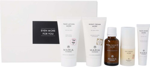 A set of skincare products includes face lotion, night cream, eye cream, face mask, and facial oil, arranged in front of a box.