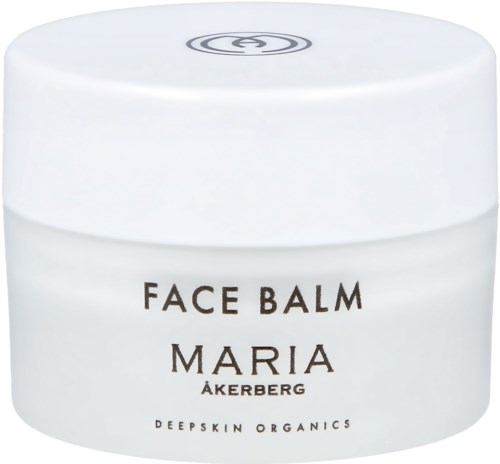 En hvit krukke merket 'Face Balm Maria Åkerberg' med en enkel svart logo på lokket.
