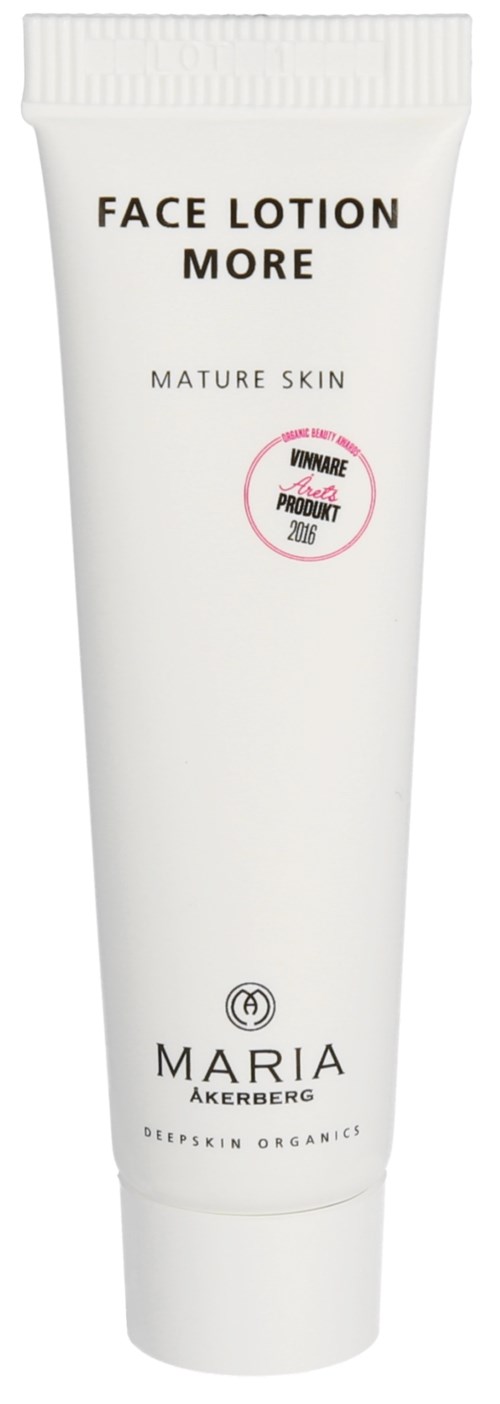 Vit tub märkt 'FACE LOTION MORE' för mogen hud. Varumärke är Maria Akerberg. Har ett rosa märke. Mest vit.
