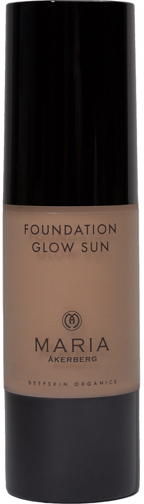 En flaska foundation märkt 'Glow Sun' av Maria Akerberg, med svart lock och beige vätska.
