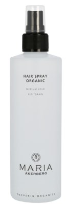 En hvid flaske mærket 'Hair Spray Organic' med sort spray, står op.