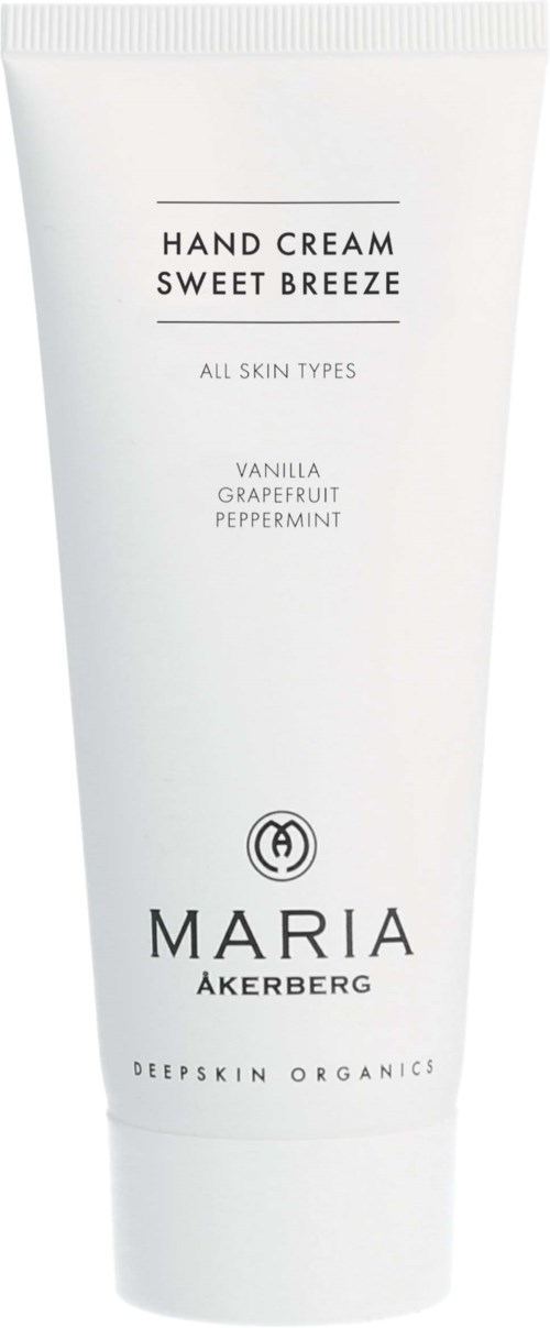 Een witte tube handcrème met de tekst "Sweet Breeze" met vanille, grapefruit en pepermuntgeur door Maria Åkerberg.