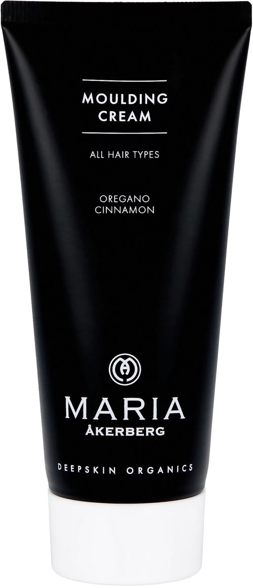 Sort tube med hårstylingcreme med hvid bund, mærket med duft 'Oregano Cinnamon' og mærke 'Maria Åkerberg'.