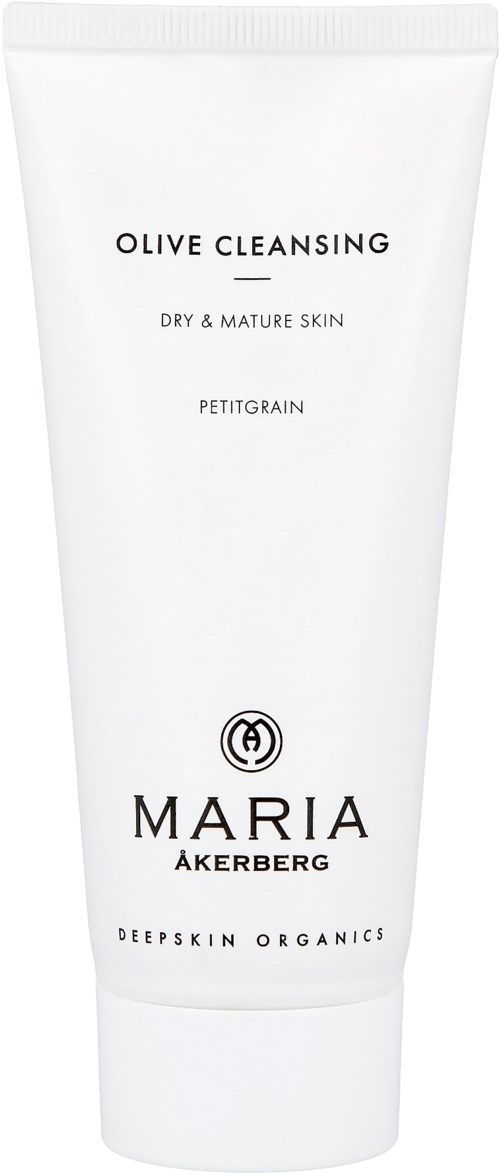 Een witte tube met 'Olive Cleansing' voor droge en rijpe huid door Maria Åkerberg.