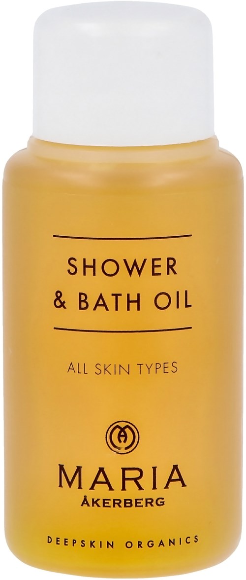 Yellow bottle labeled 'Shower & Bath Oil' for all skin types by Maria Akerberg.