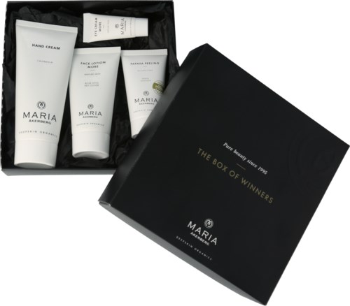 A black box labeled "The Box of Winners" containing skincare products like hand cream and face lotion.