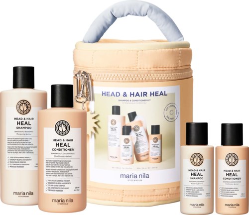 Hoidon sarja shampoo ja hoitotuotteita säilytyspussissa, kaikki märkitty Head & Hair Heal merkinnällä.