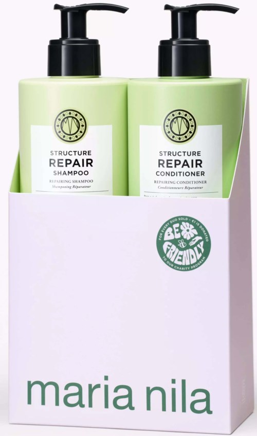 Two green bottles of hair care products in a white box. The set includes shampoo and conditioner. The products focus on repair.