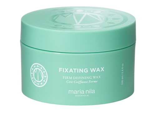 En rund, turkos behållare märkt 'Fixing Wax' för hårstyling, med märket 'maria nila' och volym på 100 ml.