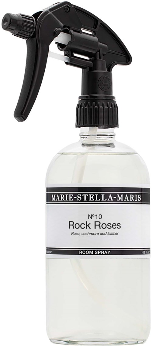 En sprayflaska märkt Rock Roses med svart handtag och klart vätska inuti.