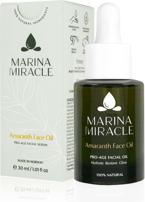 En mørkegrønn flaske med Marina Miracle Amarnath Face Oil med pipette, ved siden av dens hvite eske.