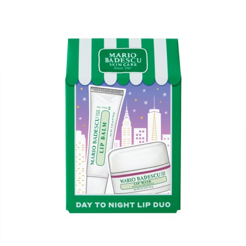 A skincare set with lip balm and face mask in a green and white box, featuring a city skyline background.