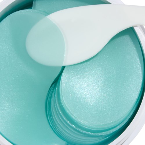Close-up of a opened teal contact lens case with a white tool inside.