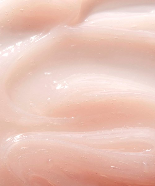Smooth, pinkish, creamy surface with shiny, flowing textures.