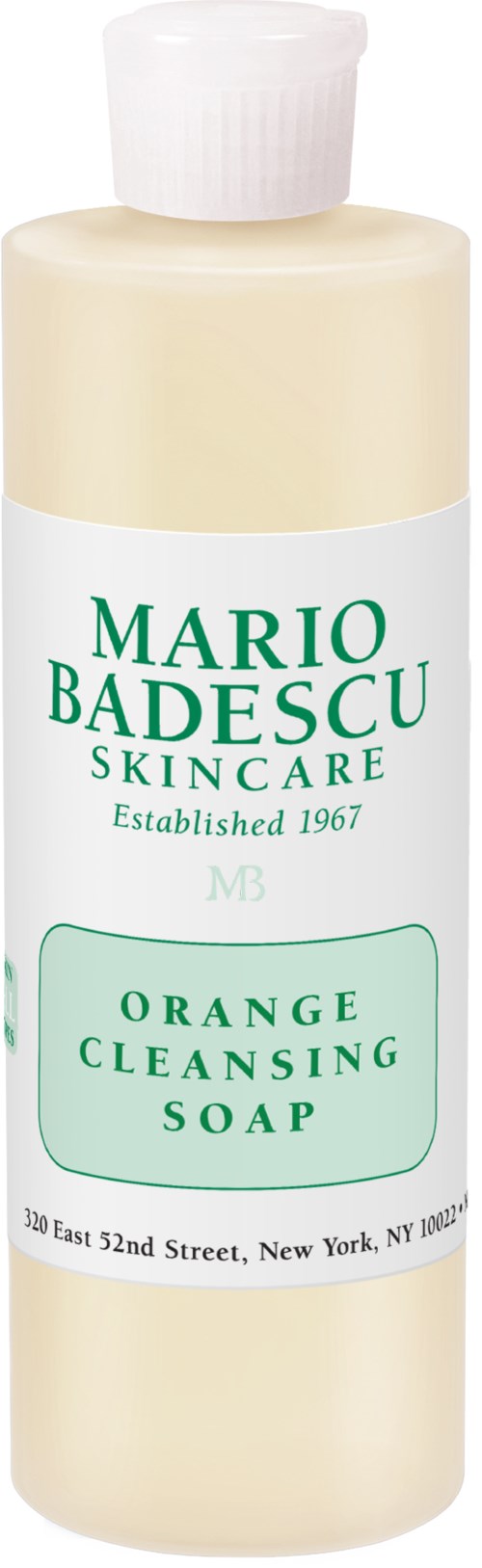 En vit flaska med vit lock, märkt 'Mario Badescu Skincare, Orange Cleansing Soap, Est. 1967', med grön text.