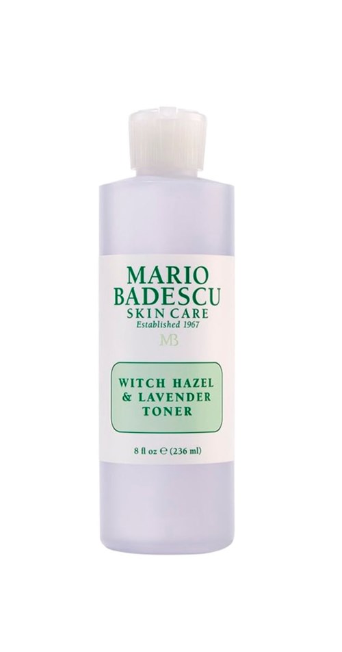 A white bottle with green text for Mario Badescu skin care, labeled 'Witch Hazel & Lavender Toner,' 8 oz.