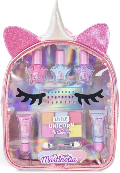 A shiny pink unicorn backpack with glittery ears, colorful nail polishes, and small beauty items inside.