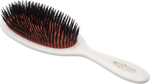 A hairbrush with black and red bristles, a white handle, and some printed text on the handle.