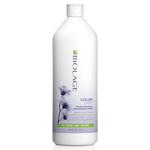 White bottle of purple shampoo labeled 'Biolage Color Last' with an orchid image and green accents.