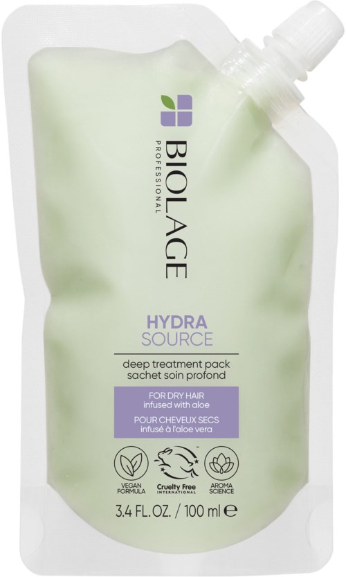 En flexibel, ljusgrön påse märkt 'Biolage Hydra Source' för hårbehandling, med pip på toppen.