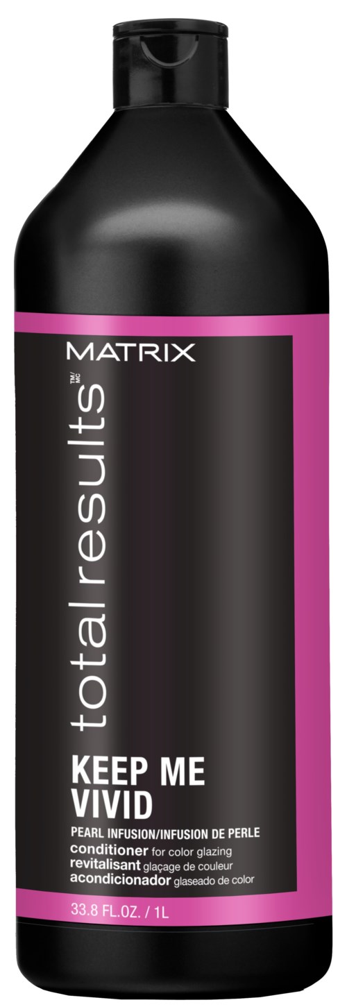 En svart flaska med rosa och vit etikett som visar 'Keep Me Vivid' och 'Matrix' för hårbalsam.