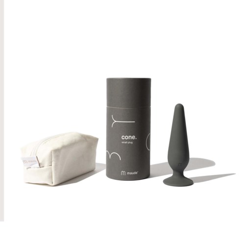 A small gray container, a black rubber tip, and a white pouch are arranged on a white surface.