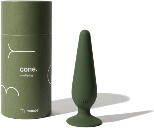 A green small object with a pointed shape next to a cylindrical green container, both on a white surface.