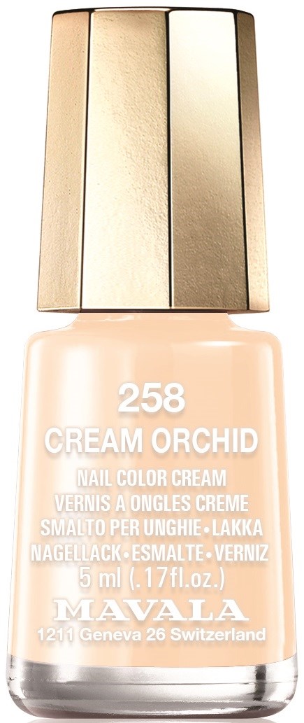 En nagellackflaska i beige färg med guldkork och etikett som står 'Cream Orchid' av Mavala.