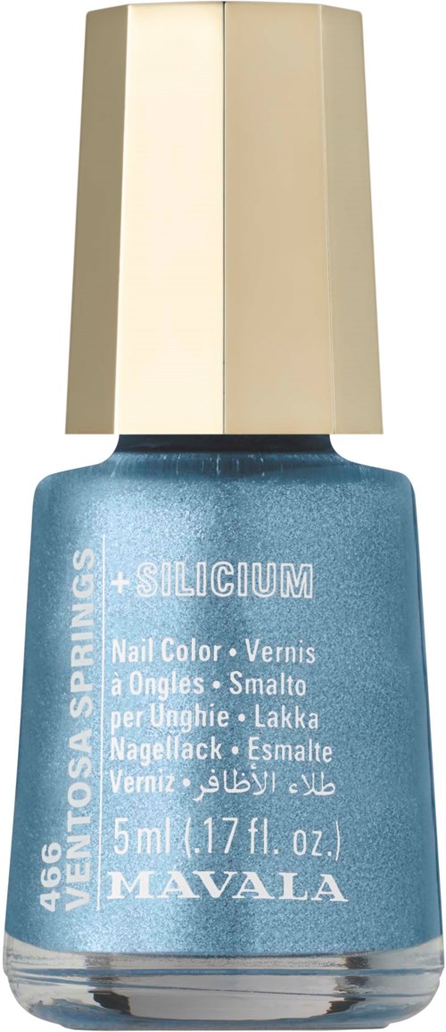 A small blue nail polish bottle with a beige cap, labeled with brand and details.