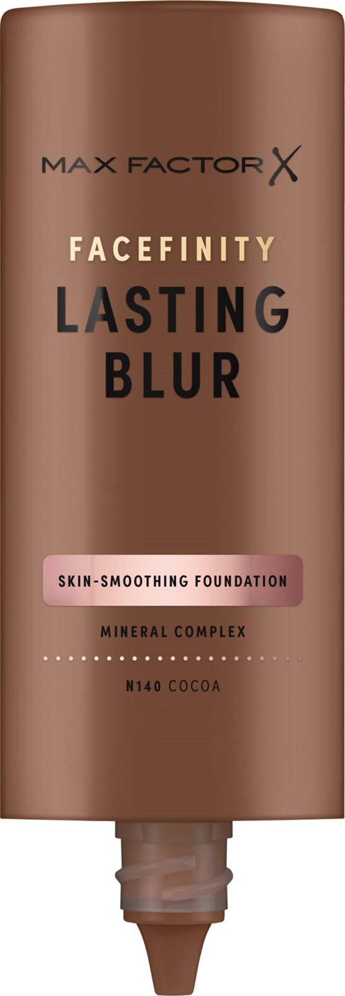 A brown squeeze tube of Max Factor Facefinity Lasting Blur foundation with a pink label indicating skin-smoothing properties.