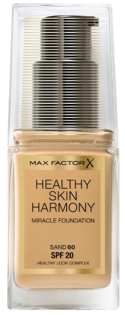 En flaske Max Factor X foundation med SPF 20, merket 'Healthy Skin Harmony' og 'Miracle Foundation', i et klart case.