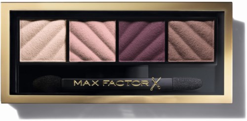 En Max Factor ögonskuggspalett med fyra nyanser och en liten applikatorborste i en svart och guldask.