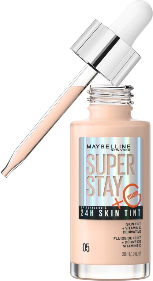 En nagelserumflaska med pipett, märkt 'Super Stay + Vitamin', innehåller hudfärg för 24 timmars användning.