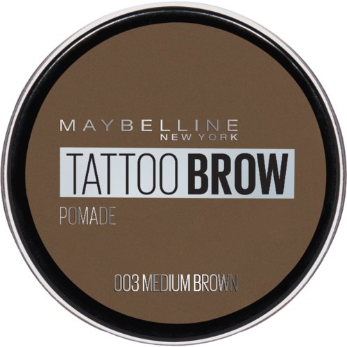 En rund behållare med Maybelline Tattoo Brow-pomada i mediumbrunt.