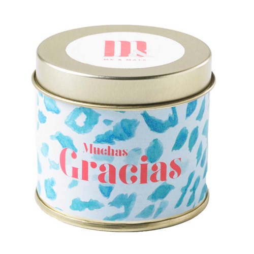 En rund boks med blå og hvit mønster og rosa tekst som sier "Muchas Gracias".