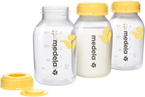 Three empty medicine bottles, one filled with cream, two yellow caps, and one cap separately shown.