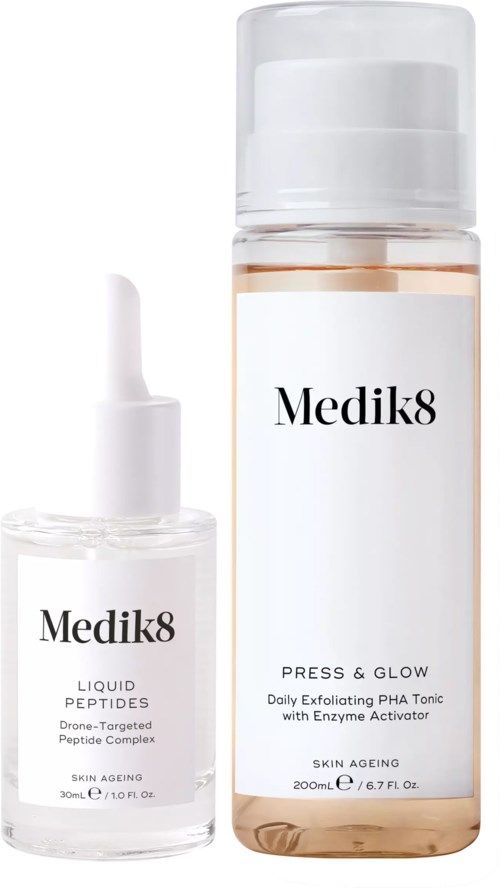 Two skincare bottles, one small with a dropper and one larger, both labeled Medik8 and designed for skin care.