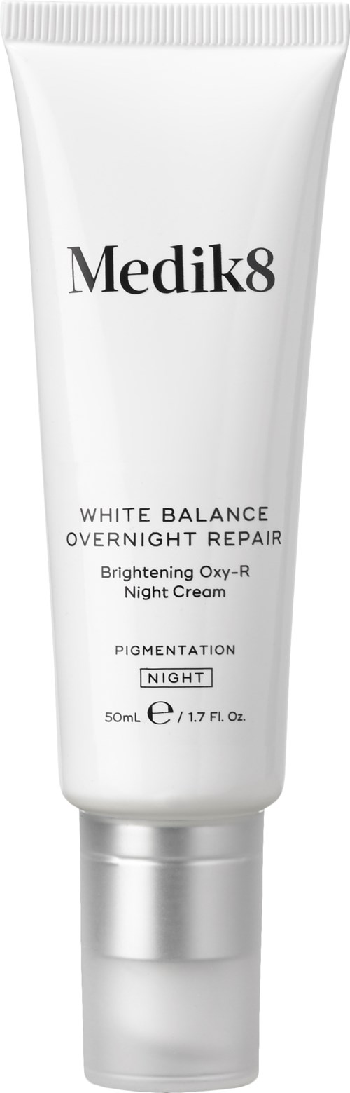 A white tube with silver cap, labeled Medik8 White Balance Night Cream for brightening and repair.
