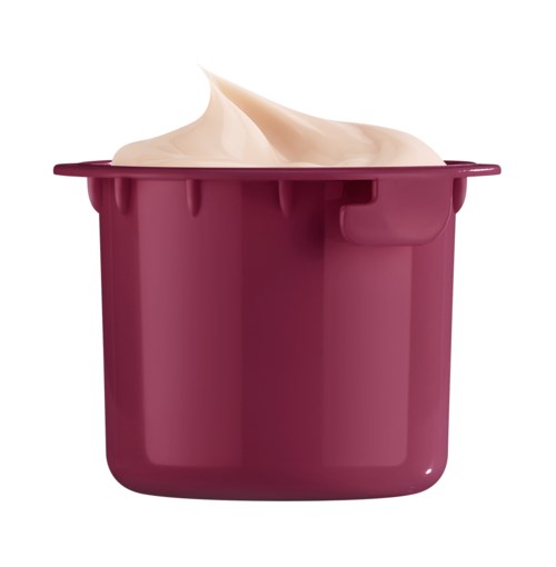 A container of pinkish cream or yogurt with a dollop on top.
