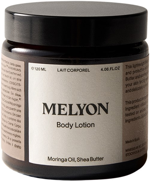 En mörkbrun burk med Melon kroppslotion och svart lock, märkt med ingredienser som Moringaolja och Shea Butter.