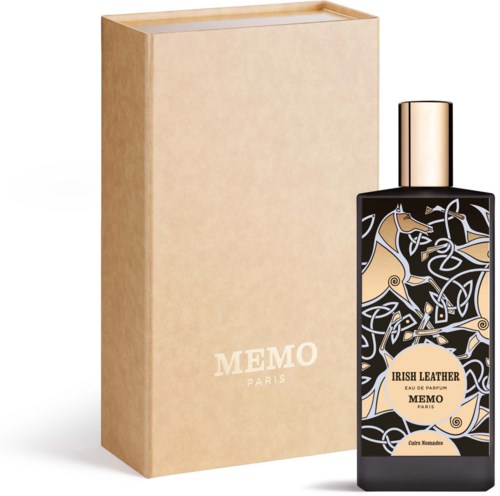 A perfume bottle with a black and gold design, next to a beige box labeled "MEMO PARIS".