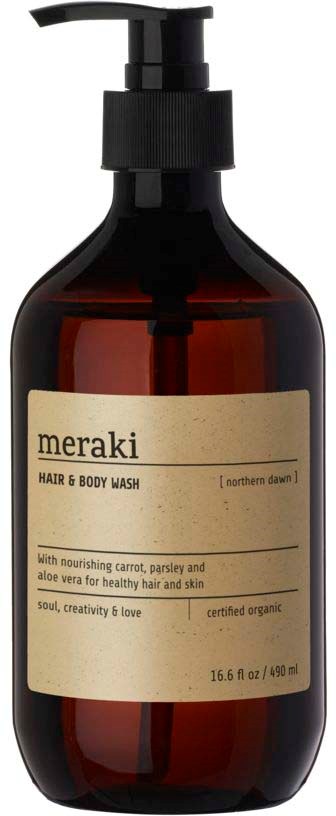 En mørk ravfarget flaske med pump, merket 'meraki' for hår- og kroppsvask, med naturlige ingredienser og økologisk sertifisering.
