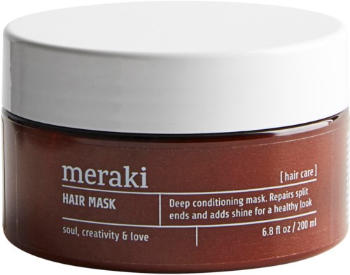 En brun burk med Meraki hårmask med vit lock, för djupinpackning och reparation av hår.