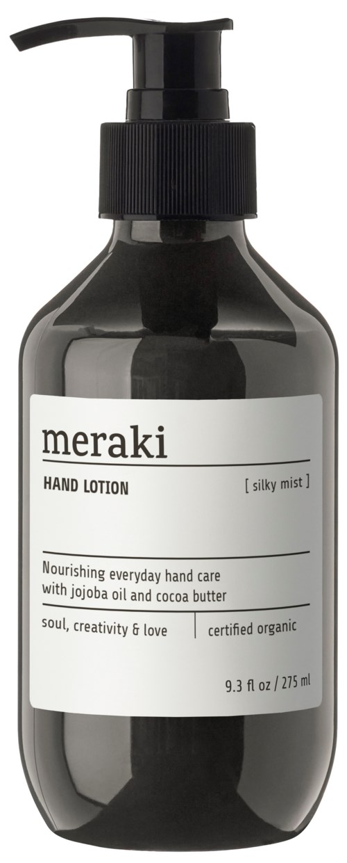 En svart håndlotionflaske med pumpe, merket "meraki, hand lotion, silky mist" og ingrediensdetaljer.