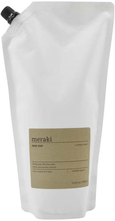 En hvit påfyllingspose med Meraki håndsåpe, beige merkelapp og svart kork.